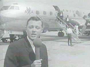 Mike Miller reporting from the airport. Check out the American Airlines plane behind him!